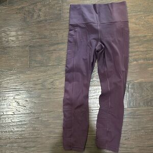 Athleta salutation stash pocket II cinch 7/8 tight. Size small